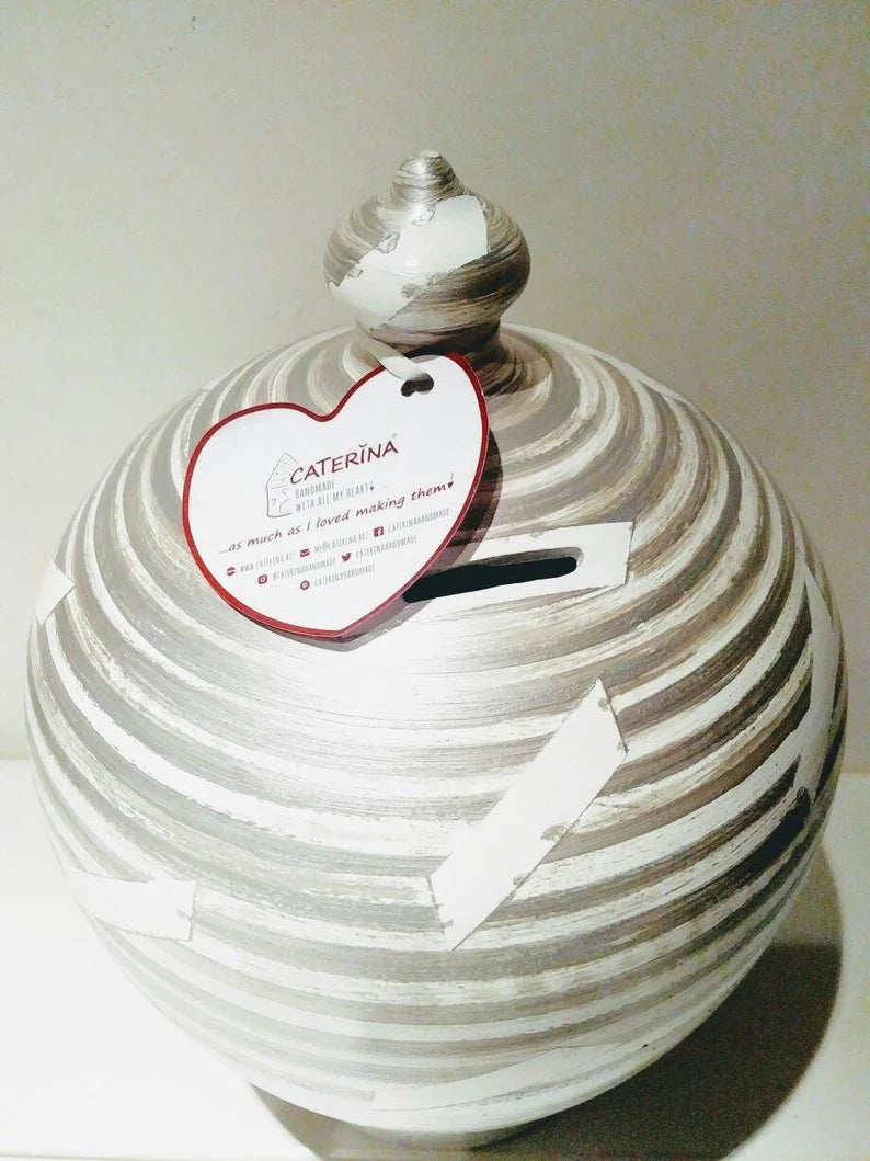 A coin bank for your cash savings, so stunning and stylish that you will never want to break open. Handmade to order in my studio in Rome, Italy, it is the perfect gift for women and men. Colors: Silver & White,  Size: 20 cm = 7.874 Inches. Circumference: 52 cm = 20 inch.  With hole and stopper plug, or without hole.