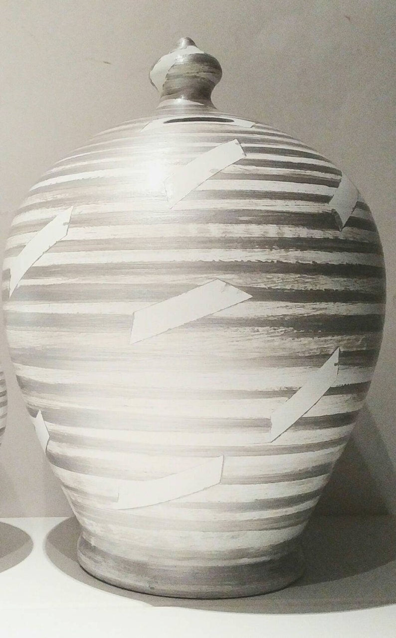 A coin bank for your cash savings, so stunning and stylish that you will never want to break open. Handmade to order in my studio in Rome, Italy, it is the perfect gift for women and men. Colors: Silver & White,  Size: 20 cm = 7.874 Inches. Circumference: 52 cm = 20 inch.  With hole and stopper plug, or without hole.